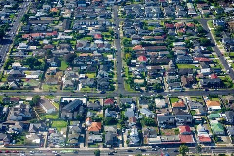 Patterns of rooftops and streets directly below in suburban zones Stock Photos