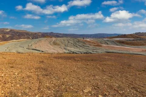 Patterns of spilled mud from the crater of a mud volcano Stock Photos