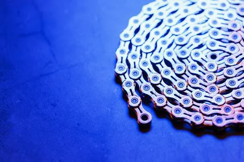 Patterns of a technological bicycle chain braided in a circle Stock Photos