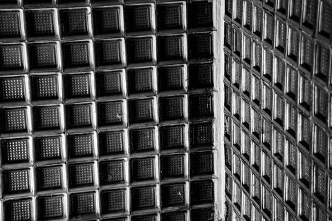 Patterns of texture seen on the surfaces of two Buildings Stock Photos
