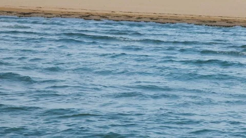 Patterns of waves reaching the shore Stock Footage 117409605