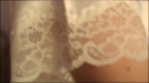 Patterns on a wedding dress, shot close-up. Slow motion. Stock Footage 80449496