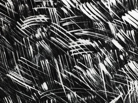 Patterns of white paint from a brush on a black background Stock Photos