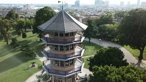 Patterson Park Pagoda Close up pull back Aerial Shot in Baltimore  With City  Video stock 79696698