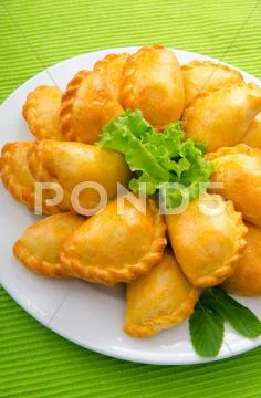 Patties stuffed with meat in the plate Stock Photos