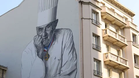 Paul Bocuse image on the wall, Lyon, France. Video stock 129835210