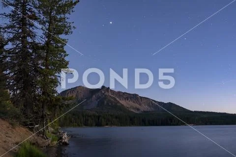 Paulina Peak from the shore of Paulina Lake in Oregon with stars visible Stock Photos