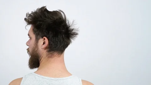 Paul's head bobbed, and half bald.A man shows up after.Hairdresser Stock Footage 122215893