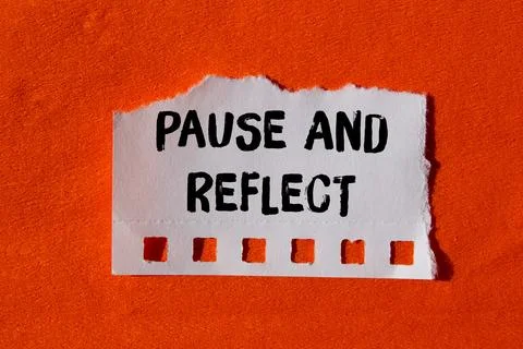 Pause and reflect message written on ripped torn paper background. Conceptu.. Stock Photos
