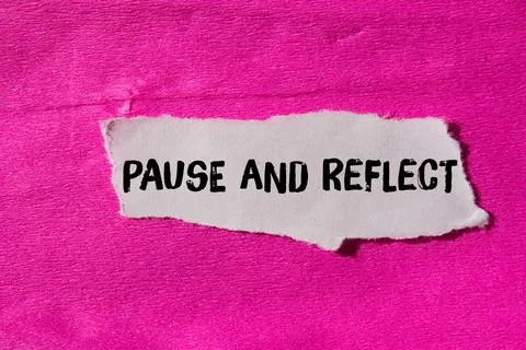 Pause and reflect message written on ripped torn paper background. Conceptu.. Stock Photos