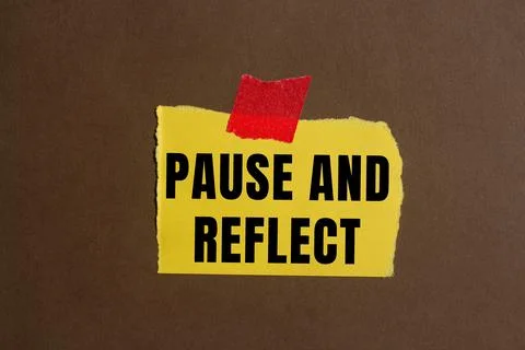 Pause and reflect message written on ripped torn paper background. Conceptu.. Stock Photos