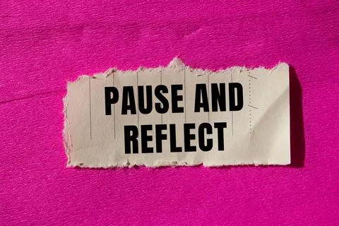 Pause and reflect message written on ripped torn paper background. Conceptu.. Stock Photos