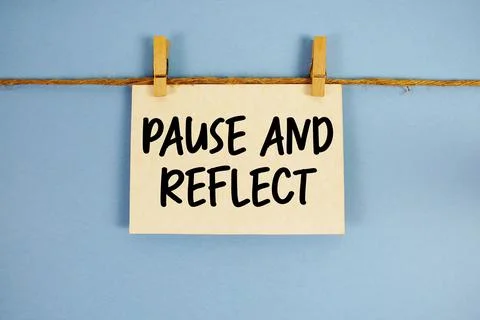 Pause and Reflect paper notes hanging on the rope with clothespins Stock Photos