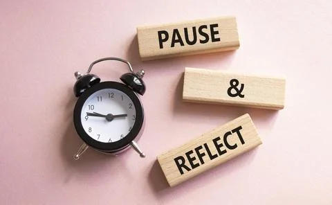 Pause and Reflect symbol. Concept words Pause and Reflect on wooden blocks... Stock Photos