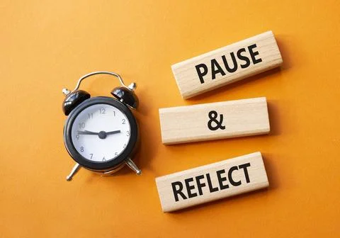 Pause and Reflect symbol. Concept words Pause and Reflect on wooden blocks... Stock Photos