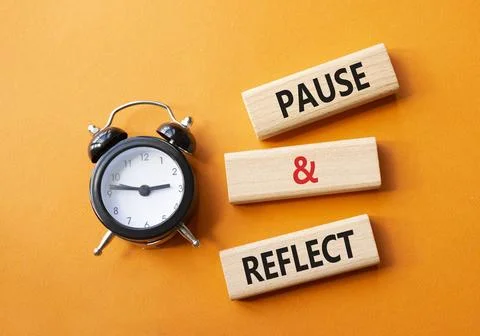 Pause and Reflect symbol. Concept words Pause and Reflect on wooden blocks... Stock Photos