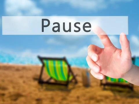 Pause - Hand pressing a button on blurred background concept on visual screen Stock Photos