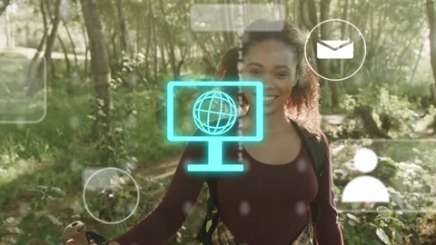 Pausing, glancing left, hiker on forest trail causing tech hologram with globe Stock Footage 333803624