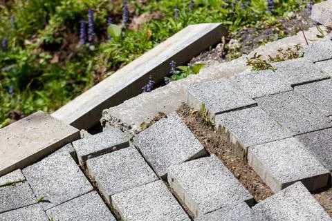 Paved area with broken concrete blocks Stock Photos