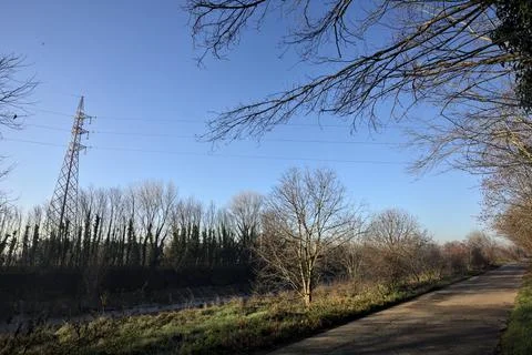 Paved path next to a river in the countryside Stock Photos