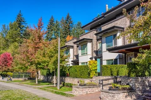 Paved pathway along the row of residential townhouses Stock Photos