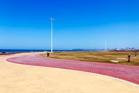Paved Promenade Pattern and Texture Against Sea and Sky Stock Photos