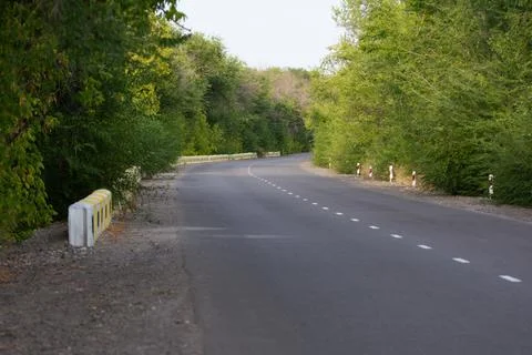 Paved road around the corner Stock Photos