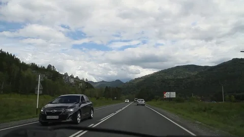 Paved road in the mountains. Shooting inside the car. Machines go.  動画素材 70670032
