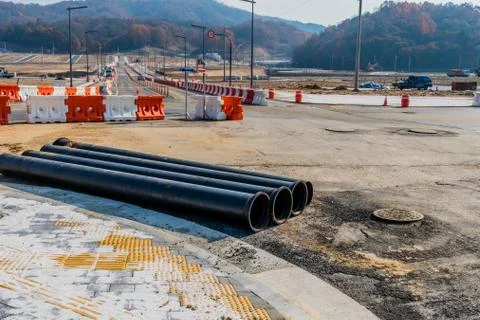 Paved road through construction site. Stock Photos