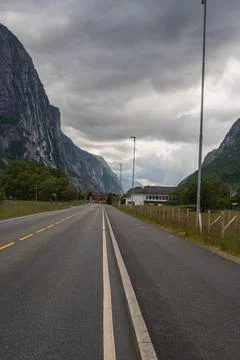 Paved Road Through Towering Cliffs in Lysebotn, Norway Stock Photos