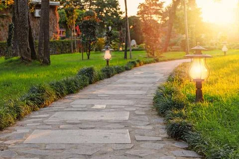 Paved stone path in the park or garden Stock Photos