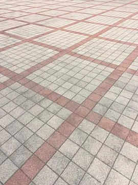 Pavement floor pattern with red intersecting lines Stock Photos