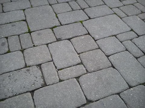 A pavement made of rectangular stone slabs. Stock Photos