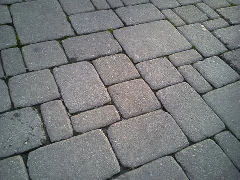 A pavement made of rectangular stone slabs. 스톡 사진