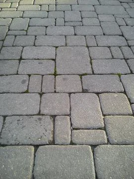 A pavement made of rectangular stone slabs. 스톡 사진