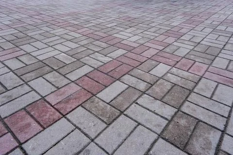 Pavement pattern made of paving stone tiles with textured surface outdoors Stock Photos