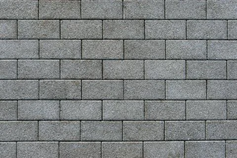 Pavement paved with gray rectangular brick Stock Photos