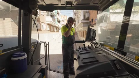 Pavement recycling, onboard view of qualified worker driving milling machine 3 Stock Footage 253233267