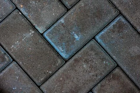 Pavement stone texture. Cobblestone sidewalk top view. Cobble rock street pat Stock Photos