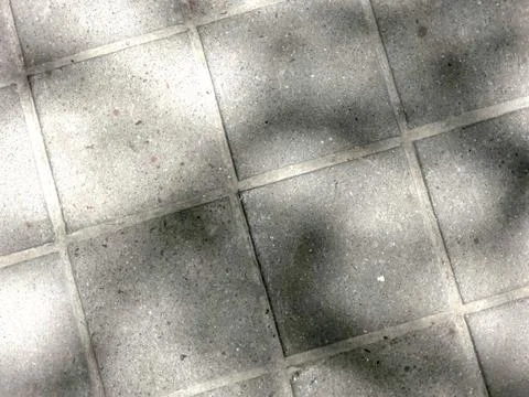 Pavement Surface With Marked Causeway Patterns Under Soft Shadows in Daylight Stock Photos