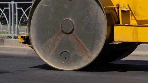 The paver mover on a flat newly made road, ramming and leveling. Asphalt paver Stock Footage 171908282