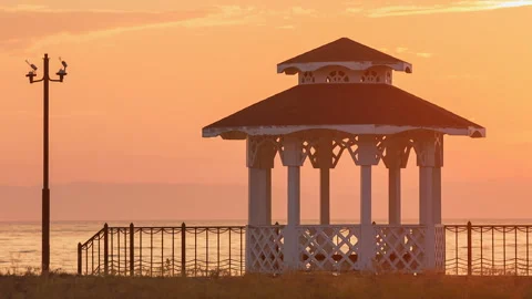 Pavilion by the lake at sunset Stock Footage 98764329