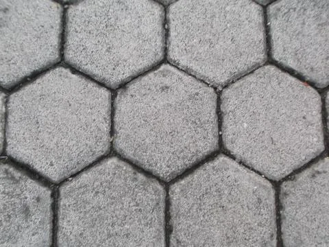 Paving Block is hexagonal in shape with a cast cement motif Stock Photos