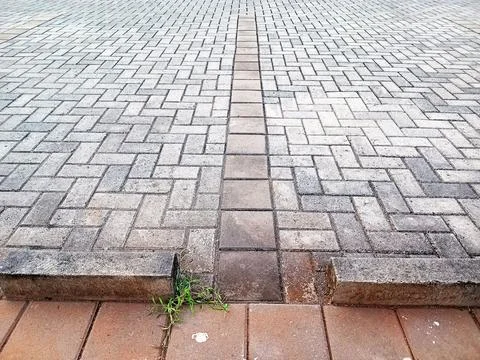 Paving block pattern ground on outdoor parking area surface Stock Photos