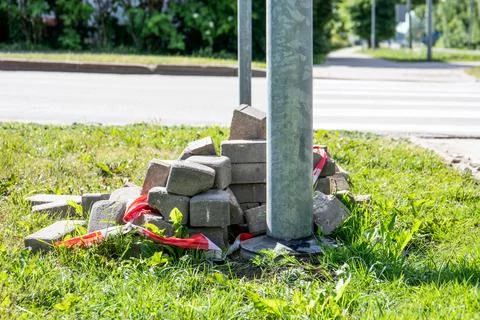 Paving bricks piled by the road, sidewalk construction Stock Photos