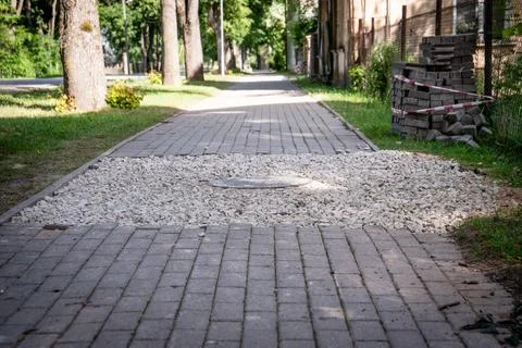 Paving bricks piled by sidewalk, construction work Foto stock
