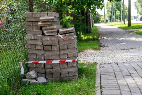 Paving bricks by sidewalk, preparing for construction Stock Photos