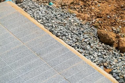 Paving installation process at outdoor construction site close-up view of l.. 写真素材