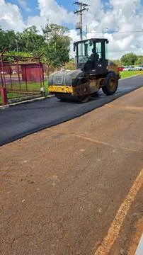Paving machine in action Stock Photos