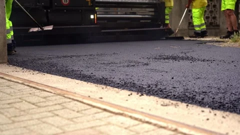 Paving Machine Laying Asphalt with Road Workers Cleaning Surface – 4K Stock Footage 311072954
